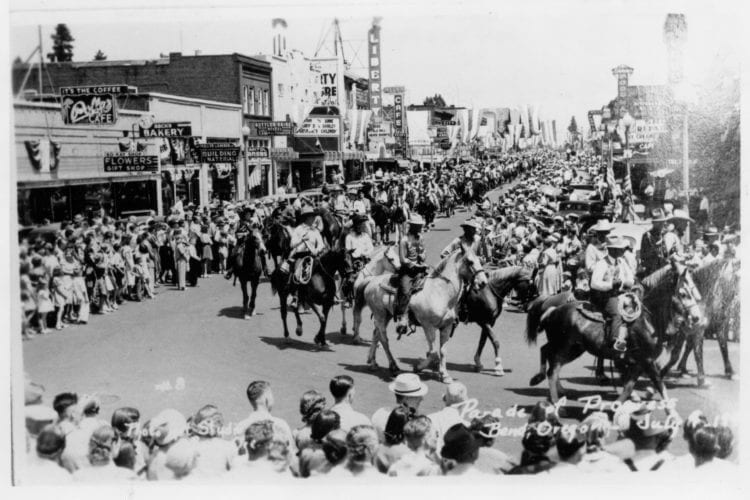 Horsebacked riders stroll through downtown circa 1940. (Note the Tower and Liberty theaters in the background.)