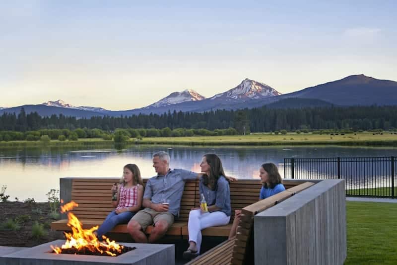 Family sitting around the fire at Black Butte Ranch in Sisters, Oregon.