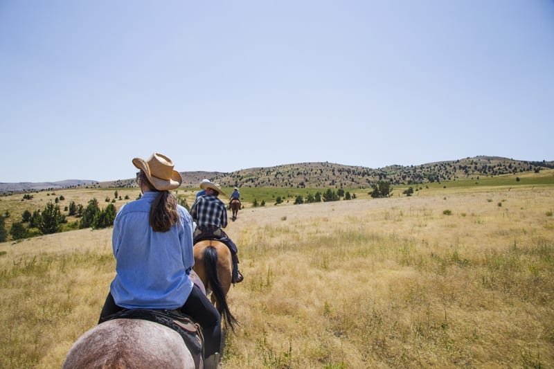 Horseback riding at Wilson Ranches Retreat in Fossil, Oregon.