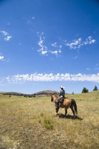 Horseback riding at Wilson Ranches Retreat in Fossil, Oregon.
