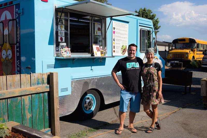 Brandon Walsh and Yoonmee Chang in front of their food truck East Meets West