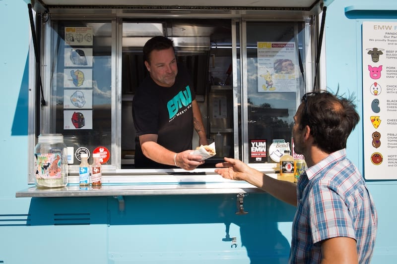 Brandon Walsh serves a pando at the East Meets West food truck.