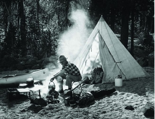 Historical icon Paul Hosmer beside his tent in Bend, Oregon