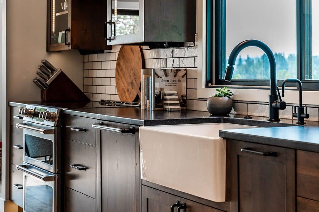 Kitchen farmhouse sink in rustic cliffside home