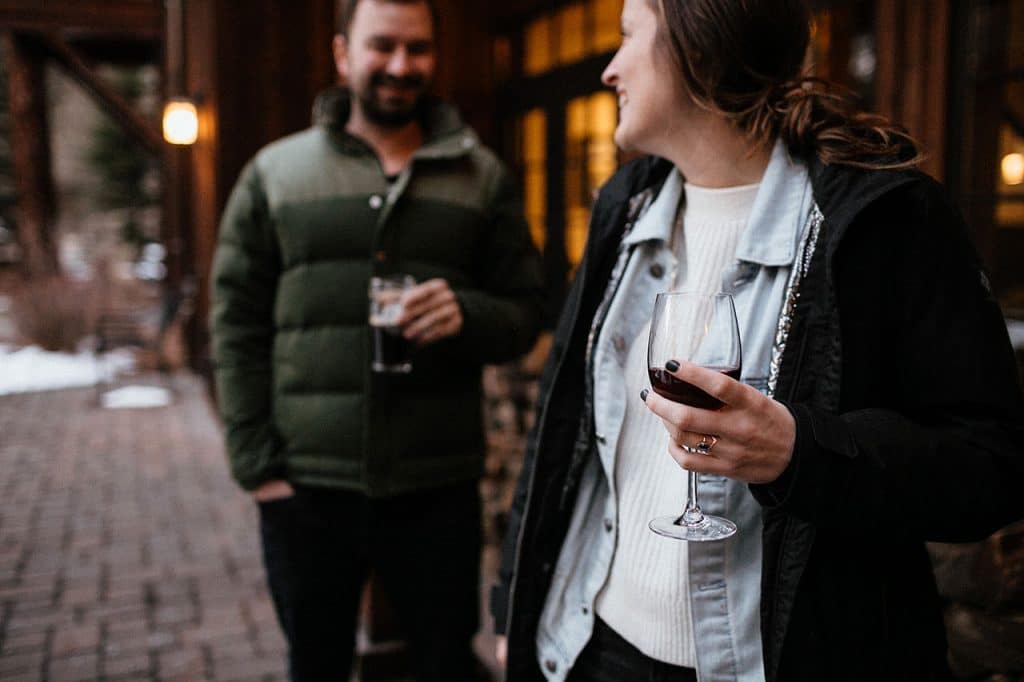 couple with wine outdoors at FivePine Lodge