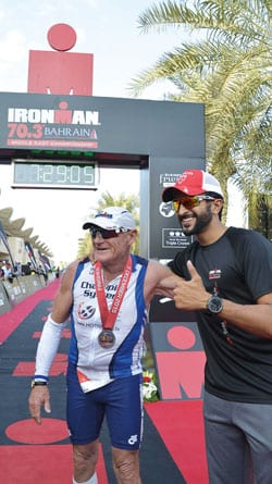 Lew and Sheikh Nasser at end of Bahrain Ironman finish line