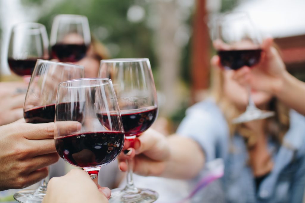 Wine glasses toasting