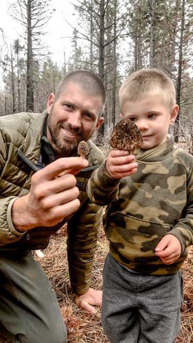 Joel and his son mushroom hunting in the forest
