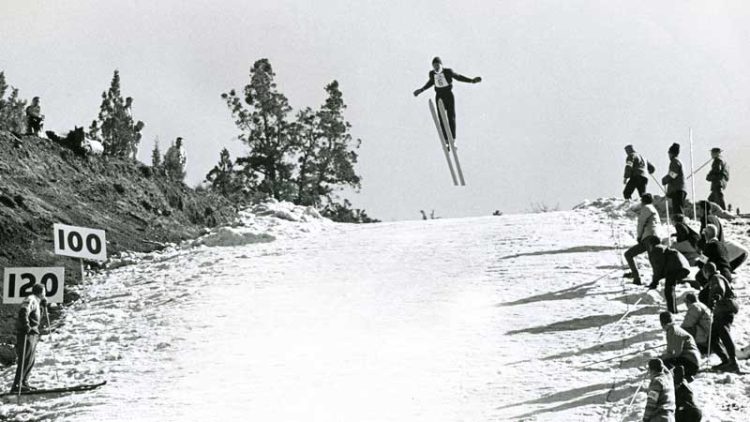 Skiier jumping at the 1965 Junior Olympics, held on Pilot Butte.