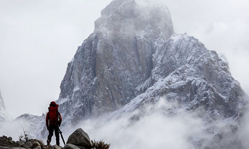 Man in front of mountain