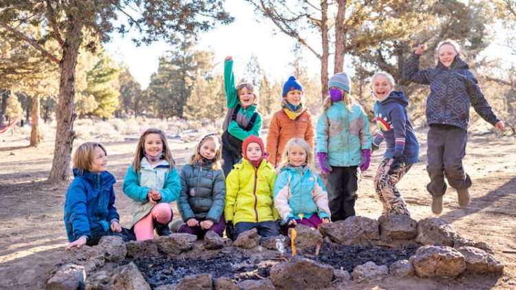 Kids learning to start fire at Bend Forest School
