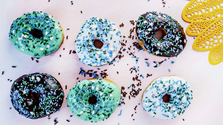 6 round donuts with sprinkles by Sweetheart Donuts