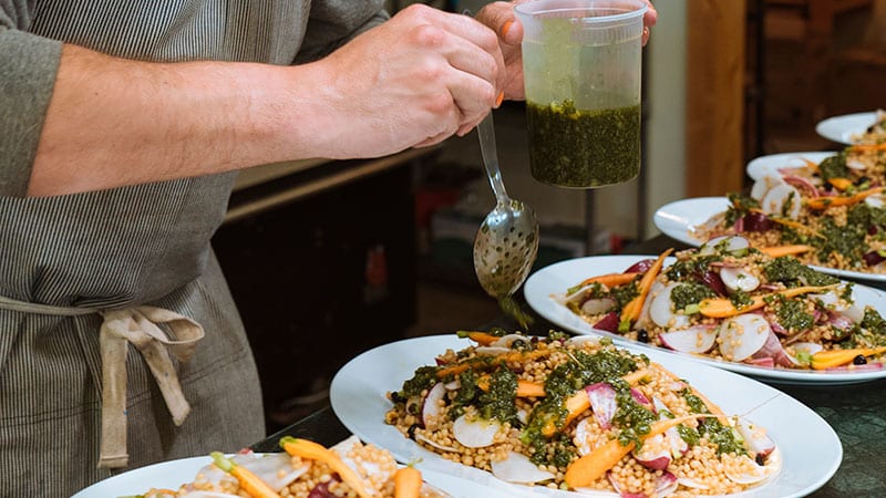 Chef preparing food for Rainshadow Organics brunch