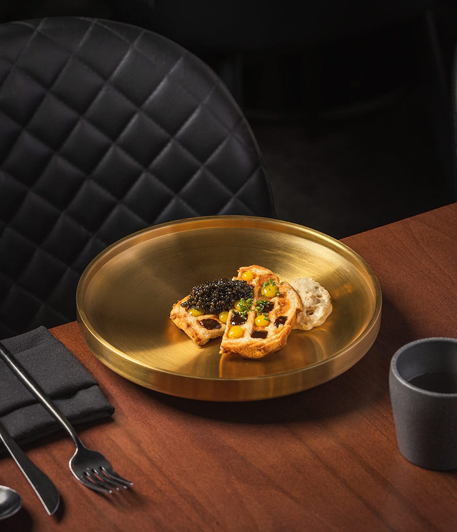 Caviar Dish served on a beautiful gold plate at Yoli in Bend