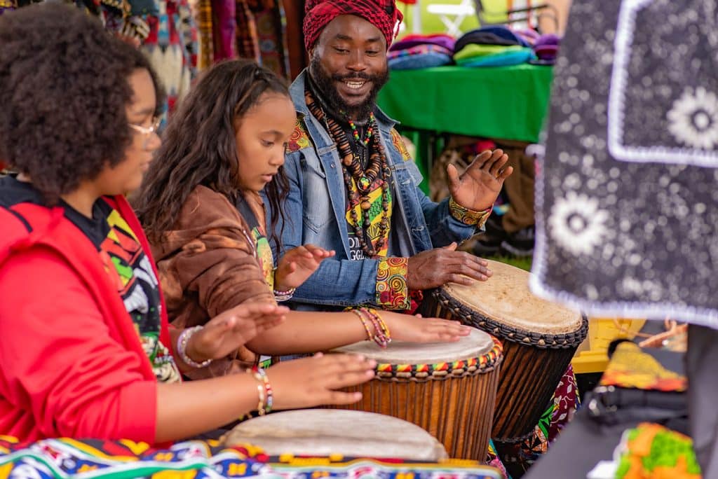 Fodeliche Syzzla leading a drum session at Juneteenth Celebration in Bend, Oregon