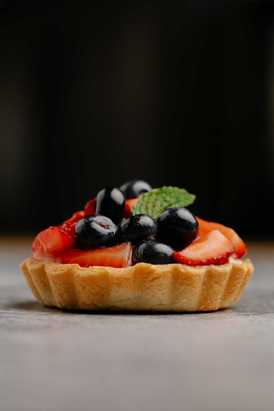 hot lava bakery fruit tart on table