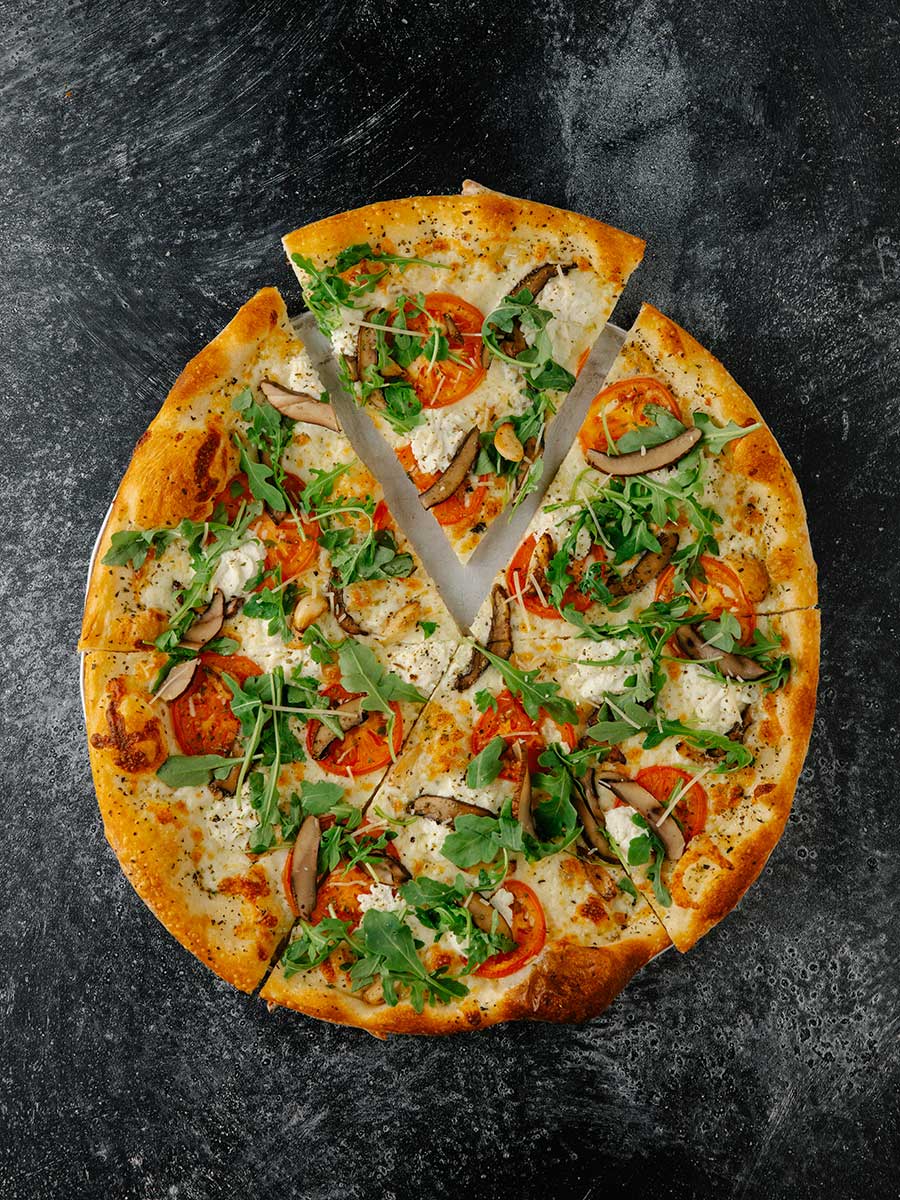 Pizza Mundo pizza on black counter top