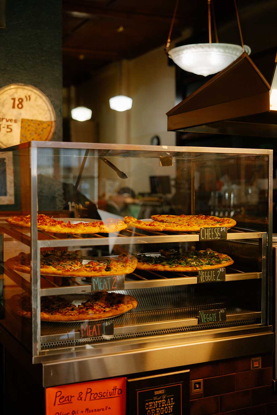 Pizza Mundo pizza's in display case