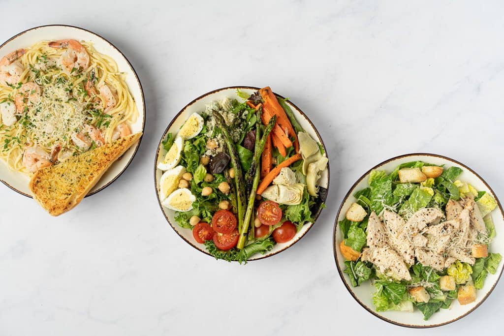 Three pastini entrees on a counter