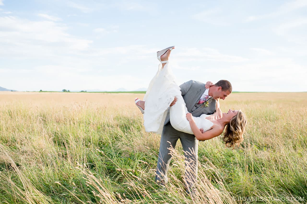 Couple dipping in a field.