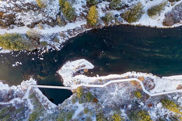 Aerial of Deschutes River Trail in winter with snow