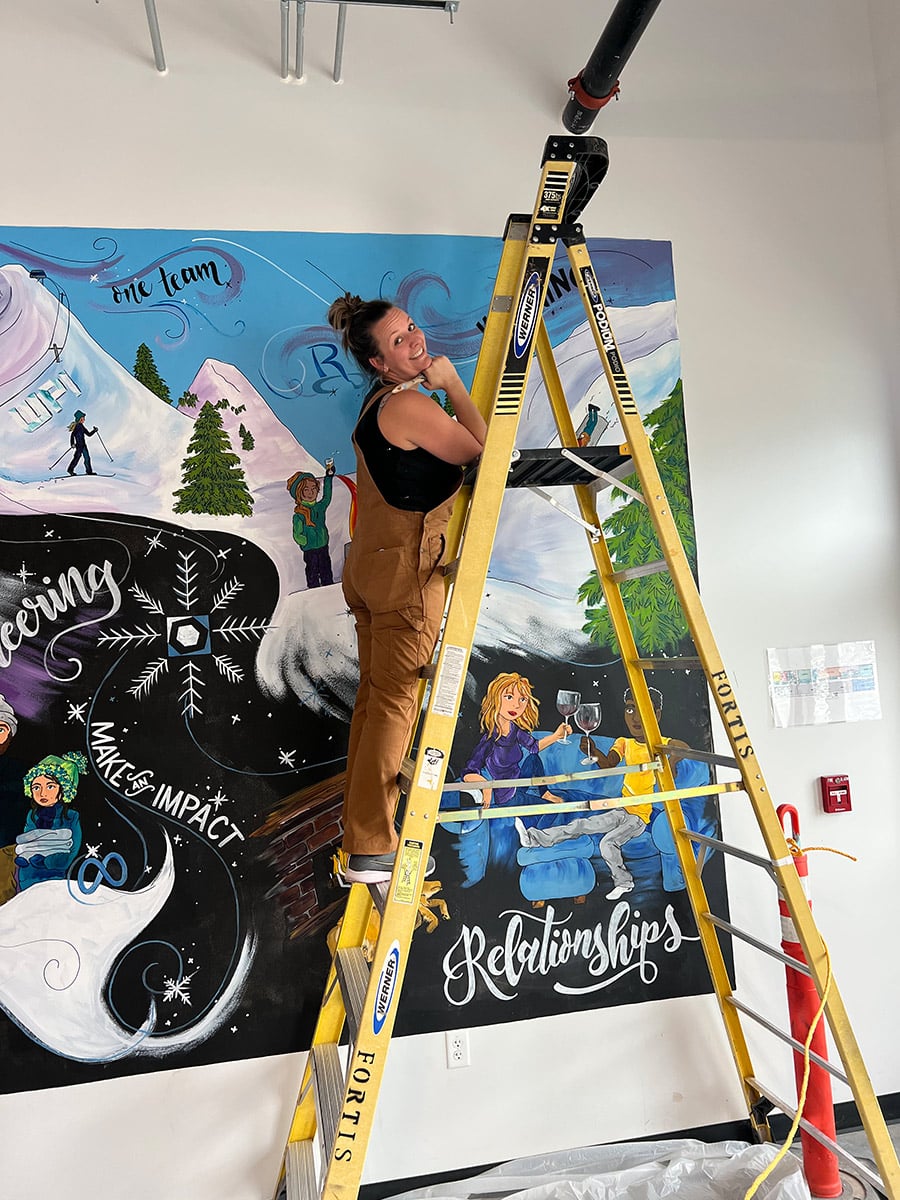 Kristen Buwalda painting mural in Bend