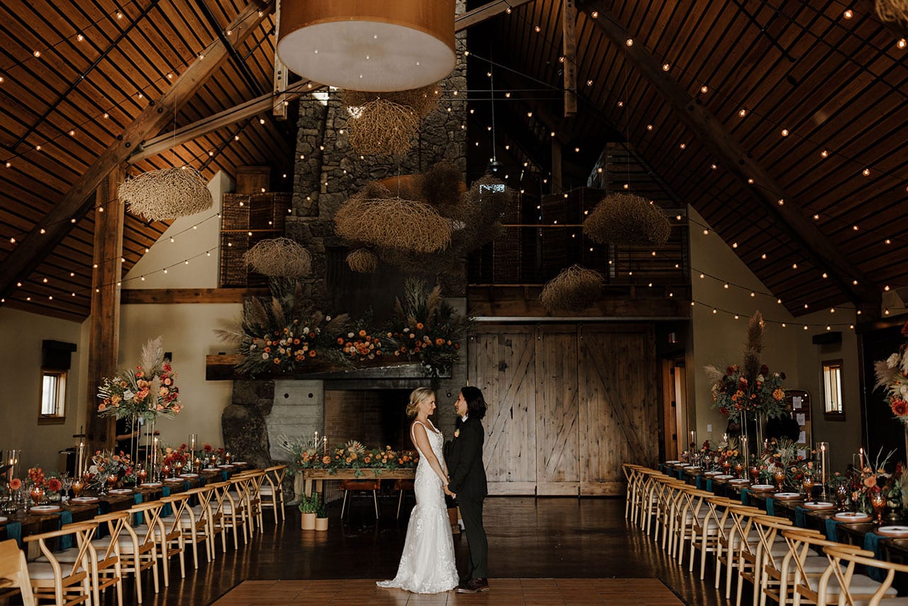 Wedding couple looking at each other inside venue