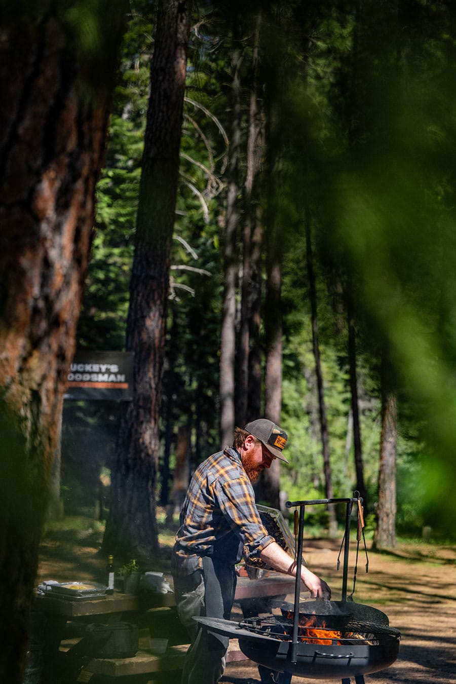 Luckey's Woodsman Off-Grid Provisions Chef prepares dinner outdoors