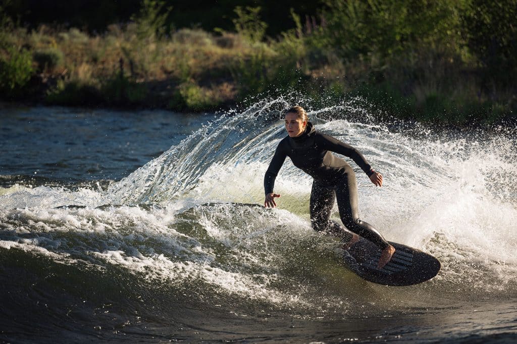 Woman ripping up a wave
