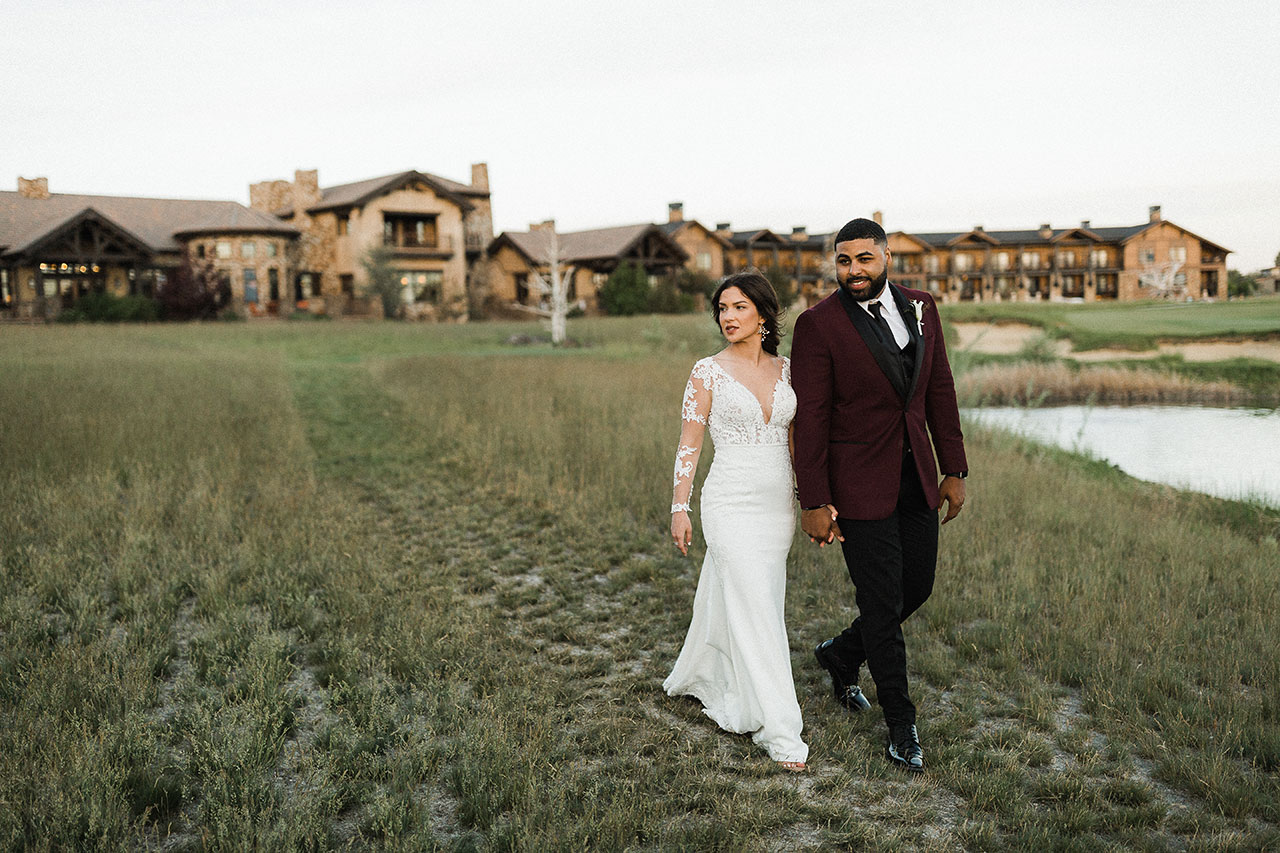 Wedding couple walking in Juniper Preserve