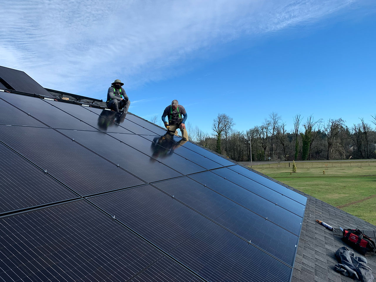 Workers working on solar panel setup