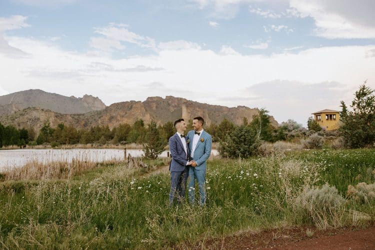 Wedding couple smiling at each other at Smith Rocks