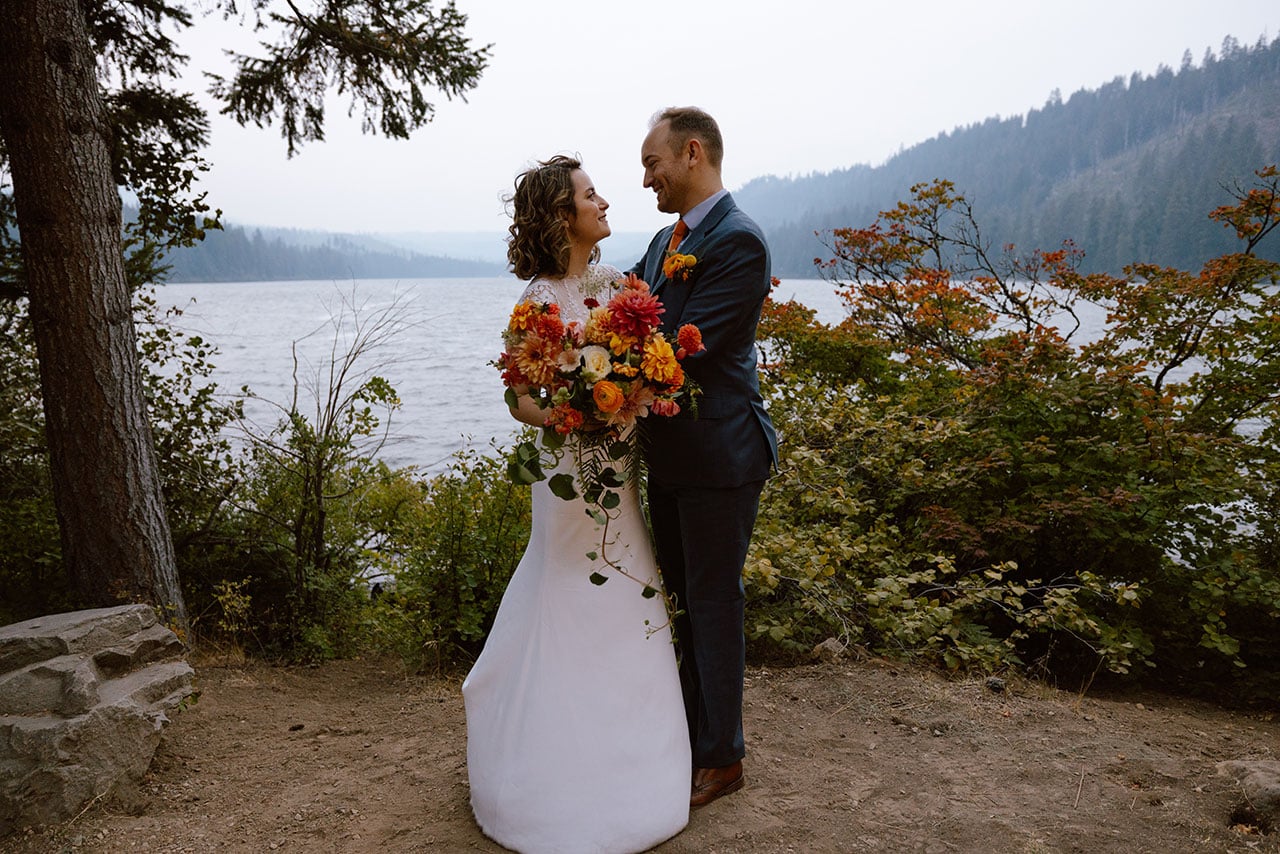 Wedding couple posing by Suttle Lake