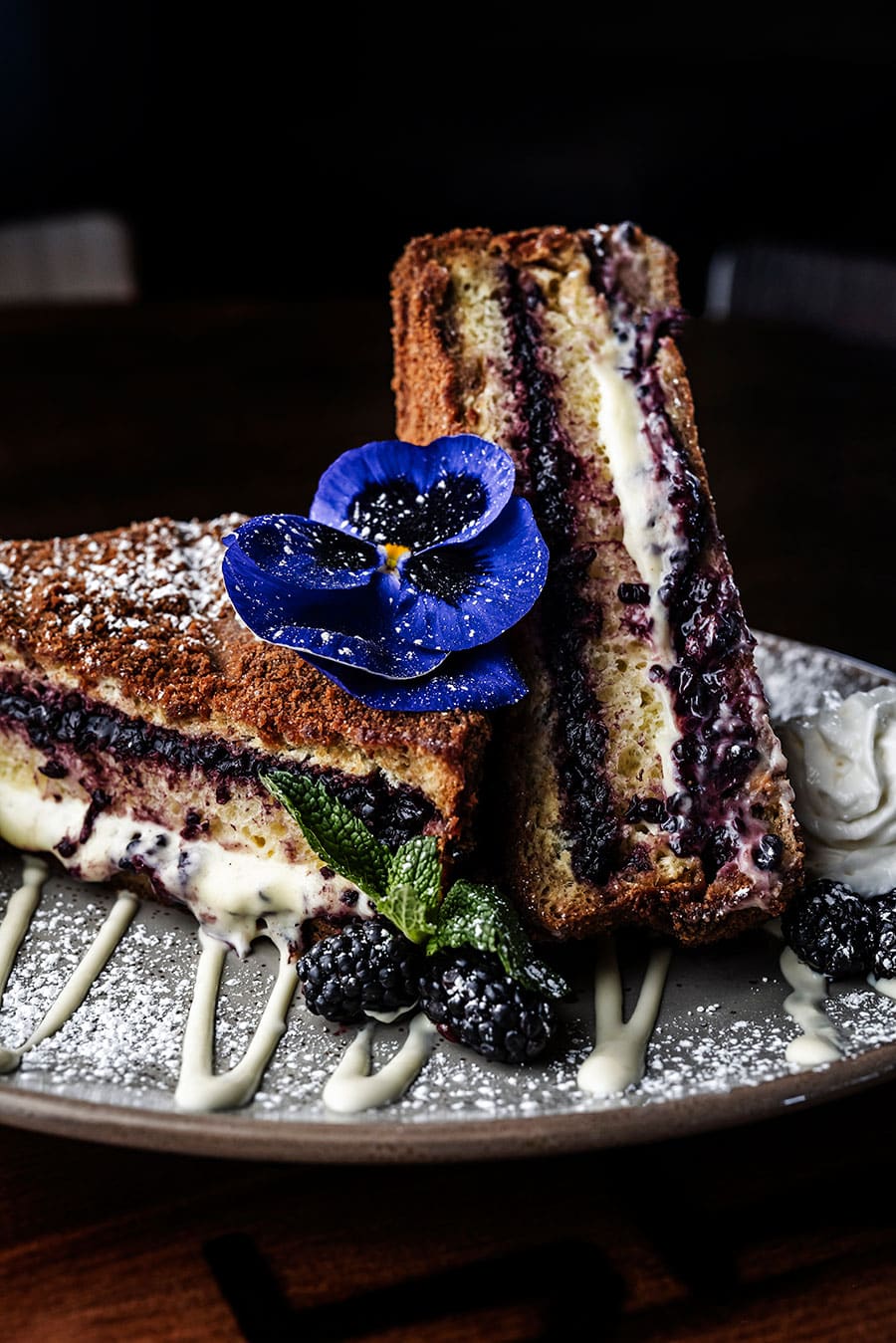 French toast and flower on a plate.