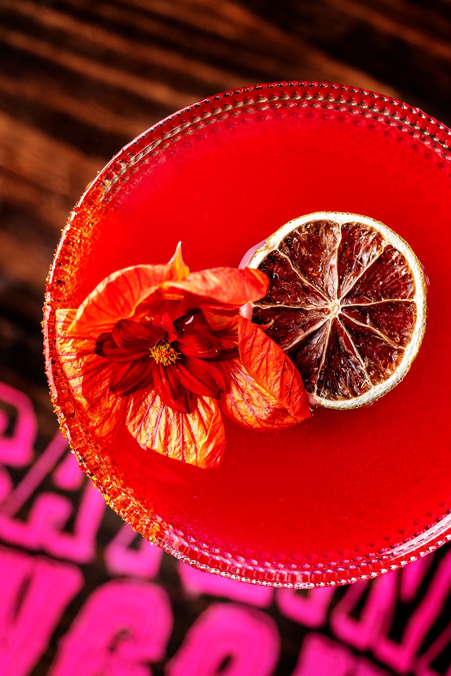 Blood orange cocktail on table.