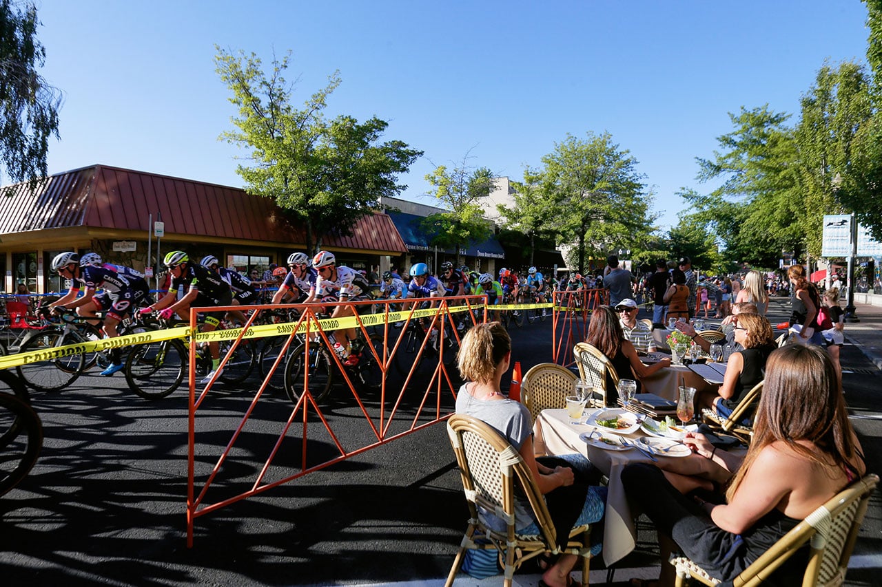 Community watching the Cascade Classic and enjoying a meal outside