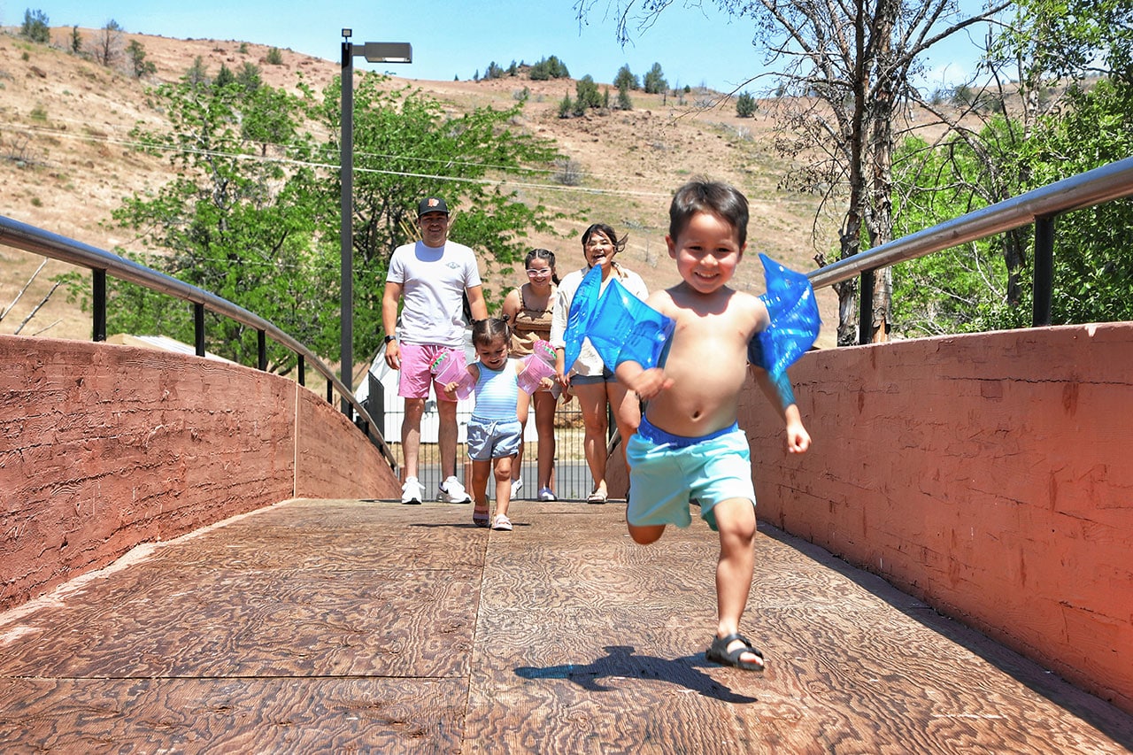 Family running to the new Kah-Nee-Ta Hot Springs Pool