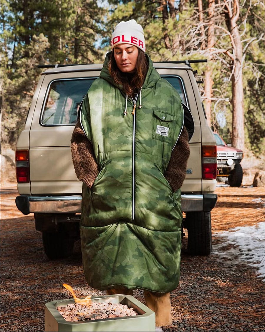 Woman wearing Poler Napsack at camp