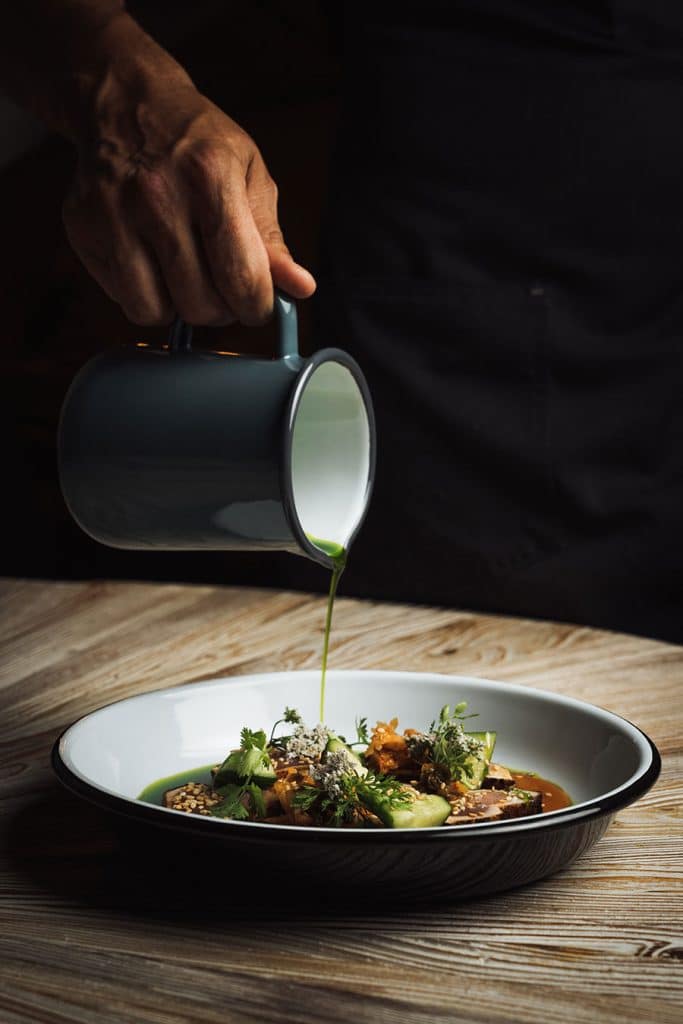 Dressing poured at Hawkeye & Huckleberry Lounge