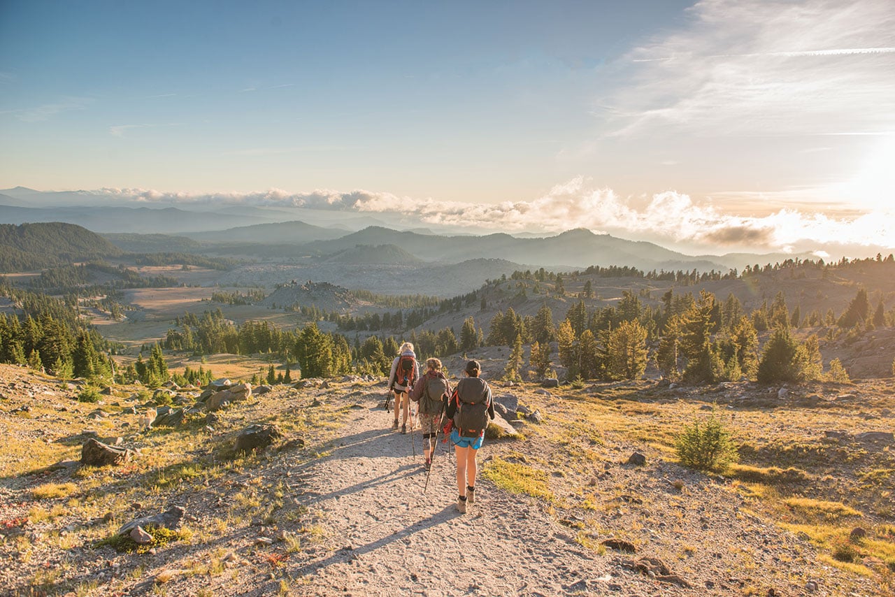 Three hikers exploring three sisters wilderness