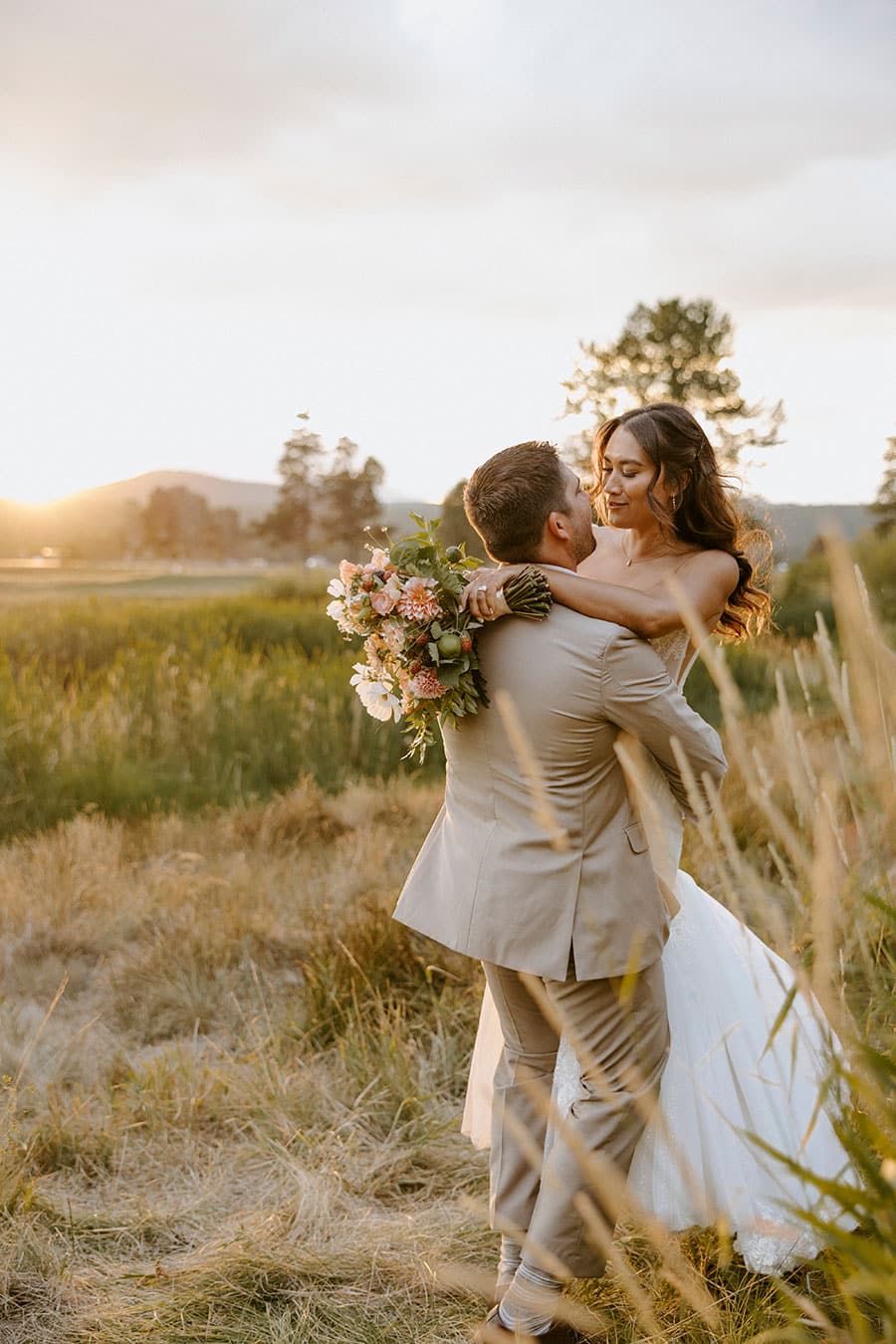 Couple kissing in a field