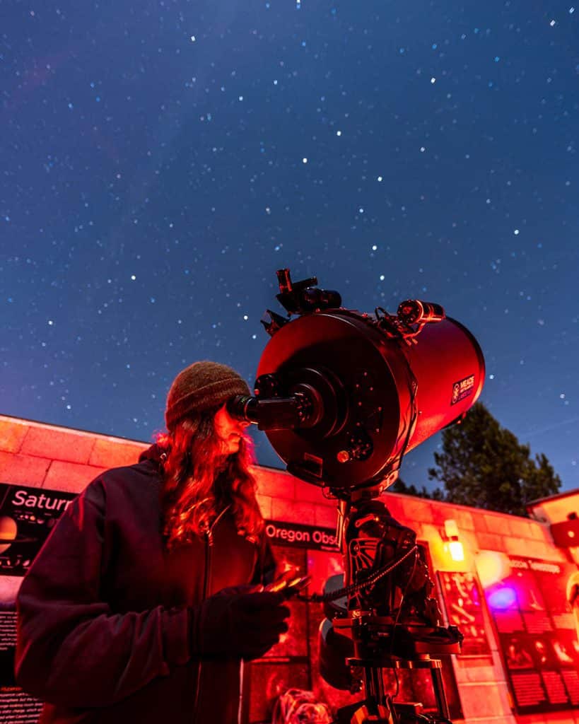 Stargazer through telescope