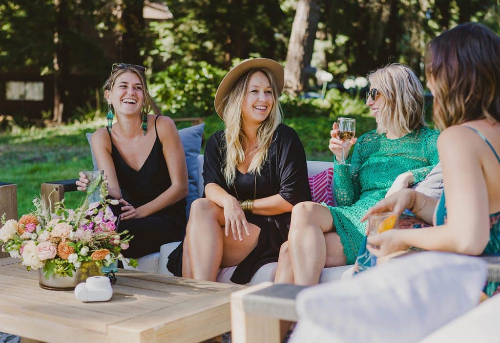 women enjoying cocktails from Kraft Bar