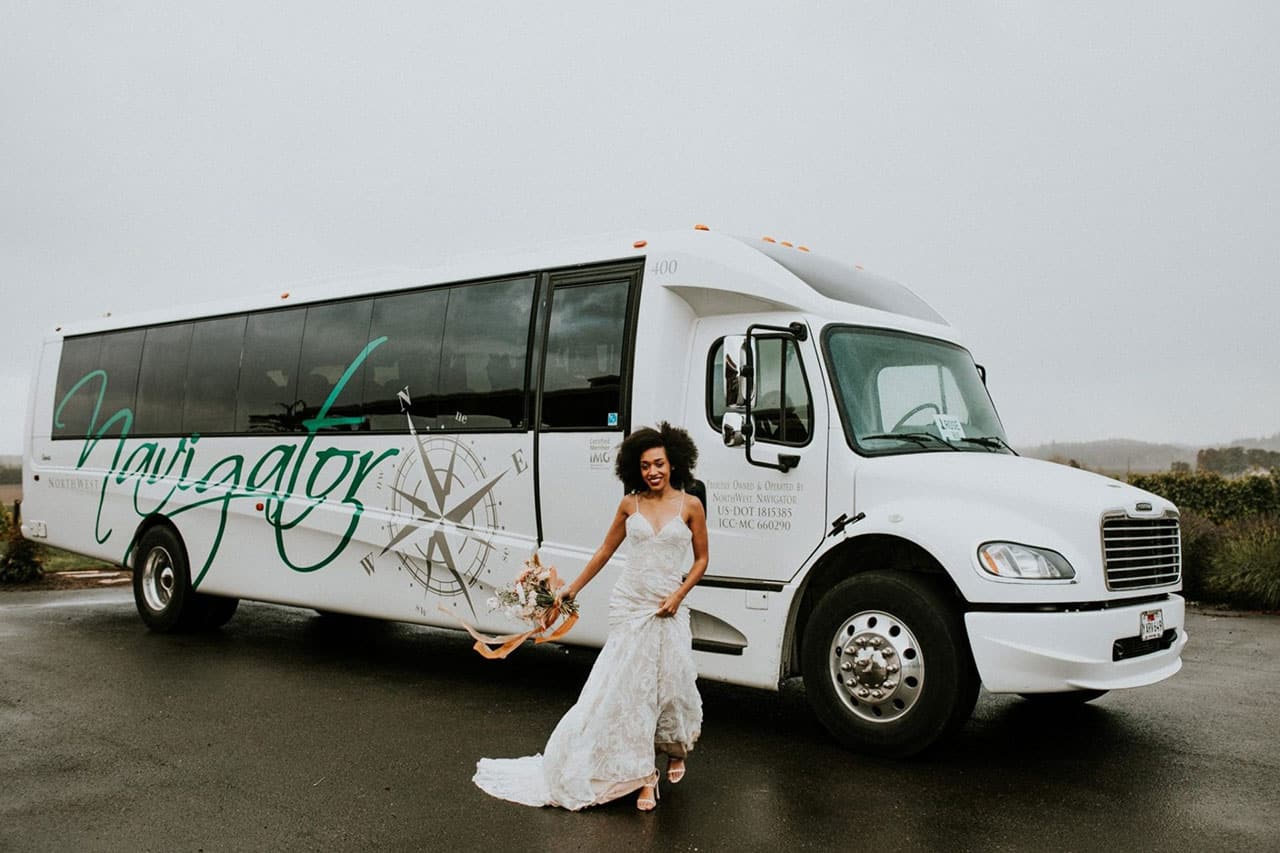 Bride in front of bus for transportation