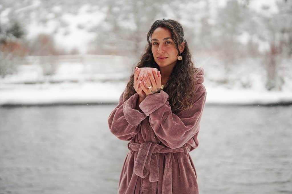 Elif Koyuturk about to cold plunge into the Deschutes River in the snow