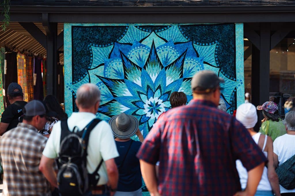 Sisters Quilt Show Attendees looking at quilts