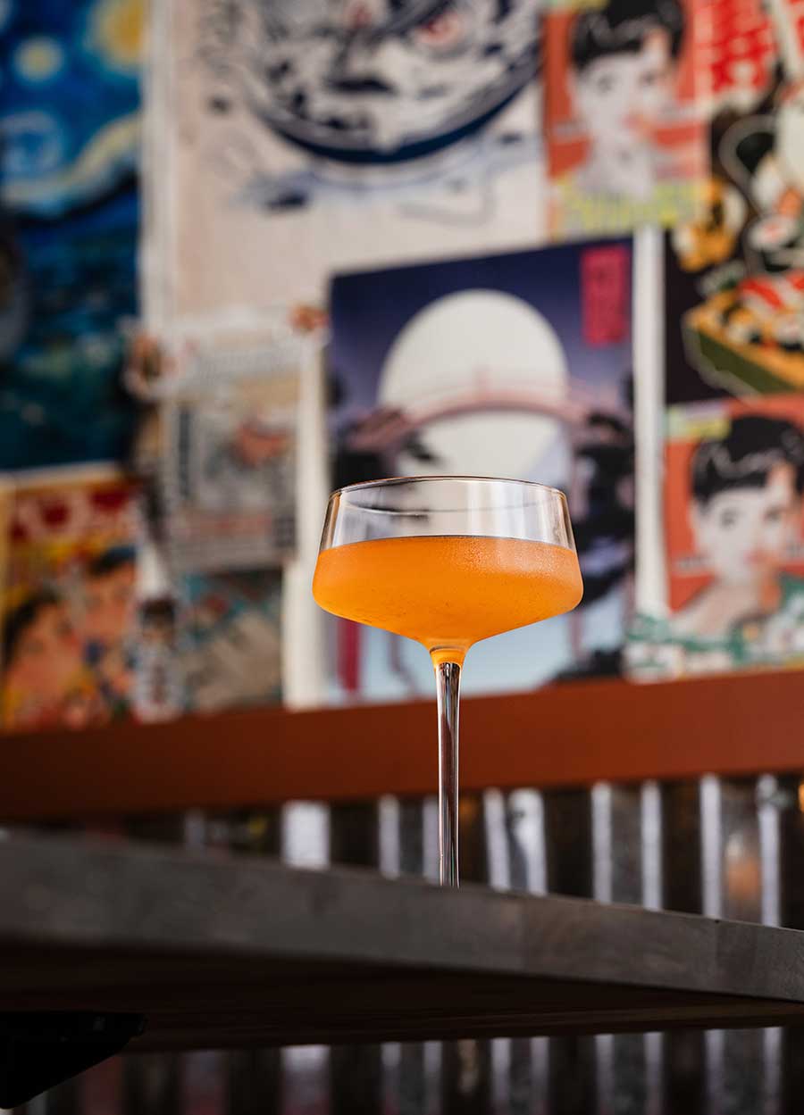 orange cocktail on table from Yokocho Izakaya in Bend