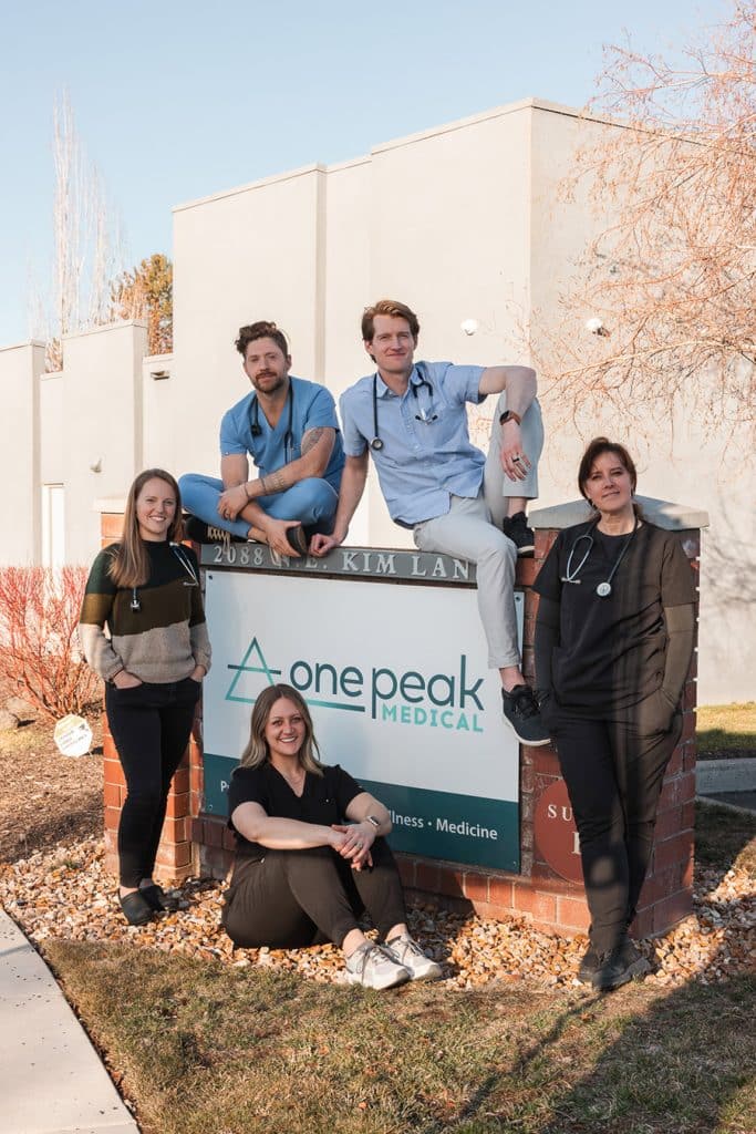 OnePeak Medical Bend Oregon Team in front of sign
