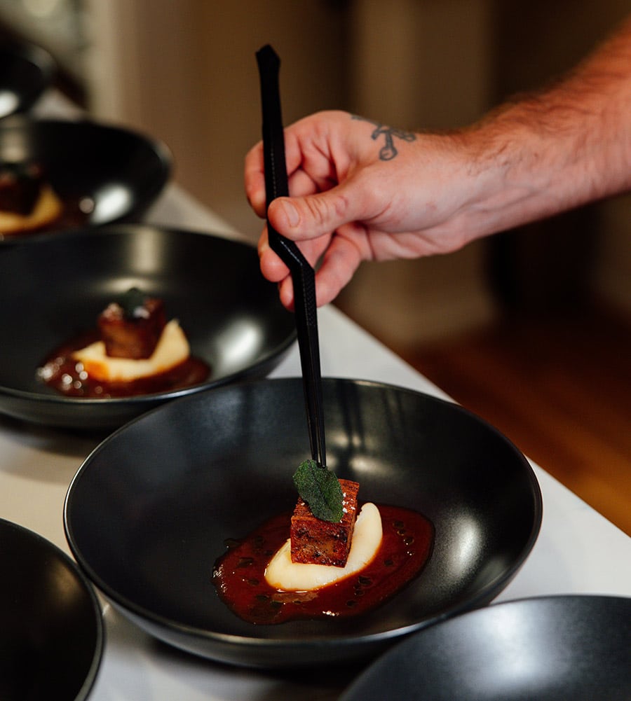 Chef Dave Bodi putting finishing touches on a dessert