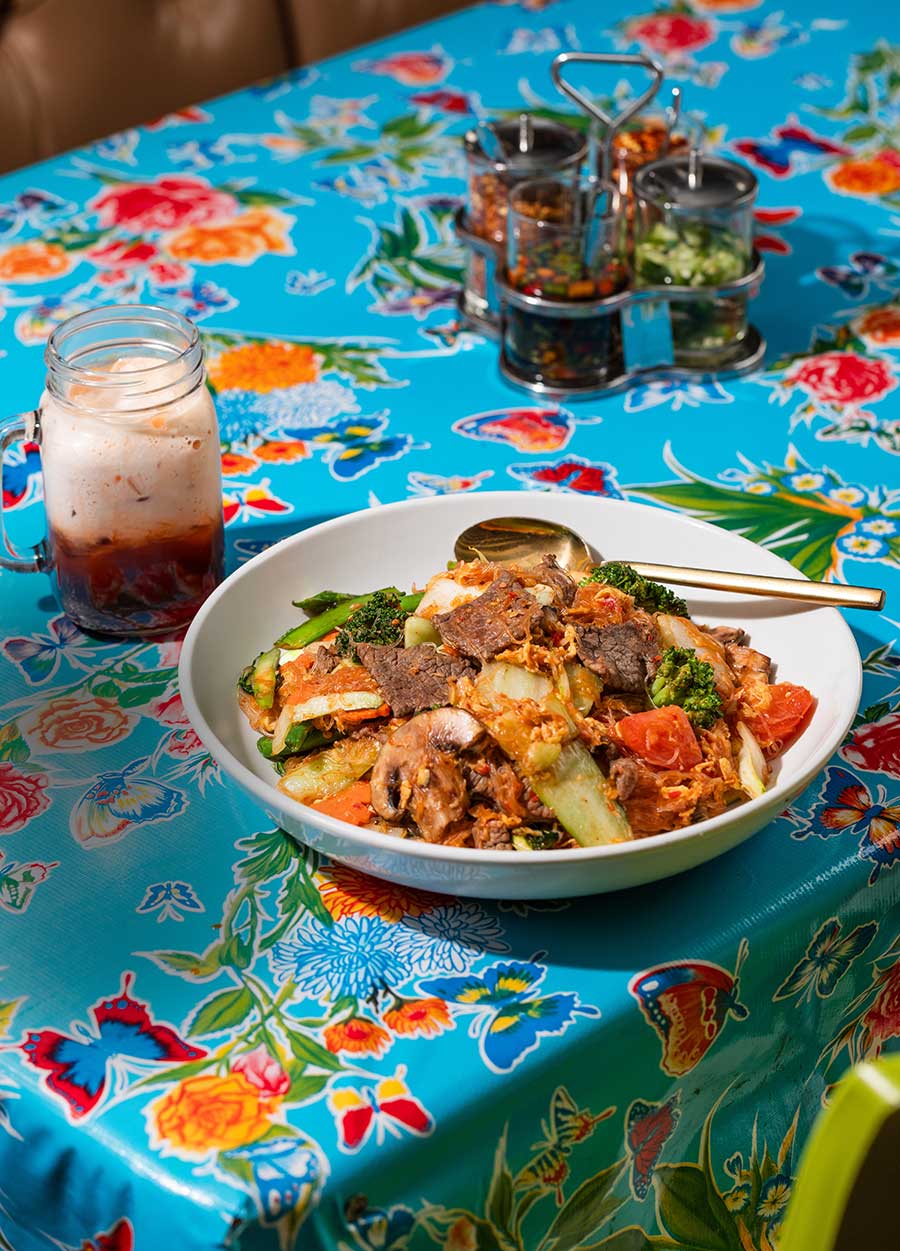Wild Rose entree and ice tea on blue floral tablecloth